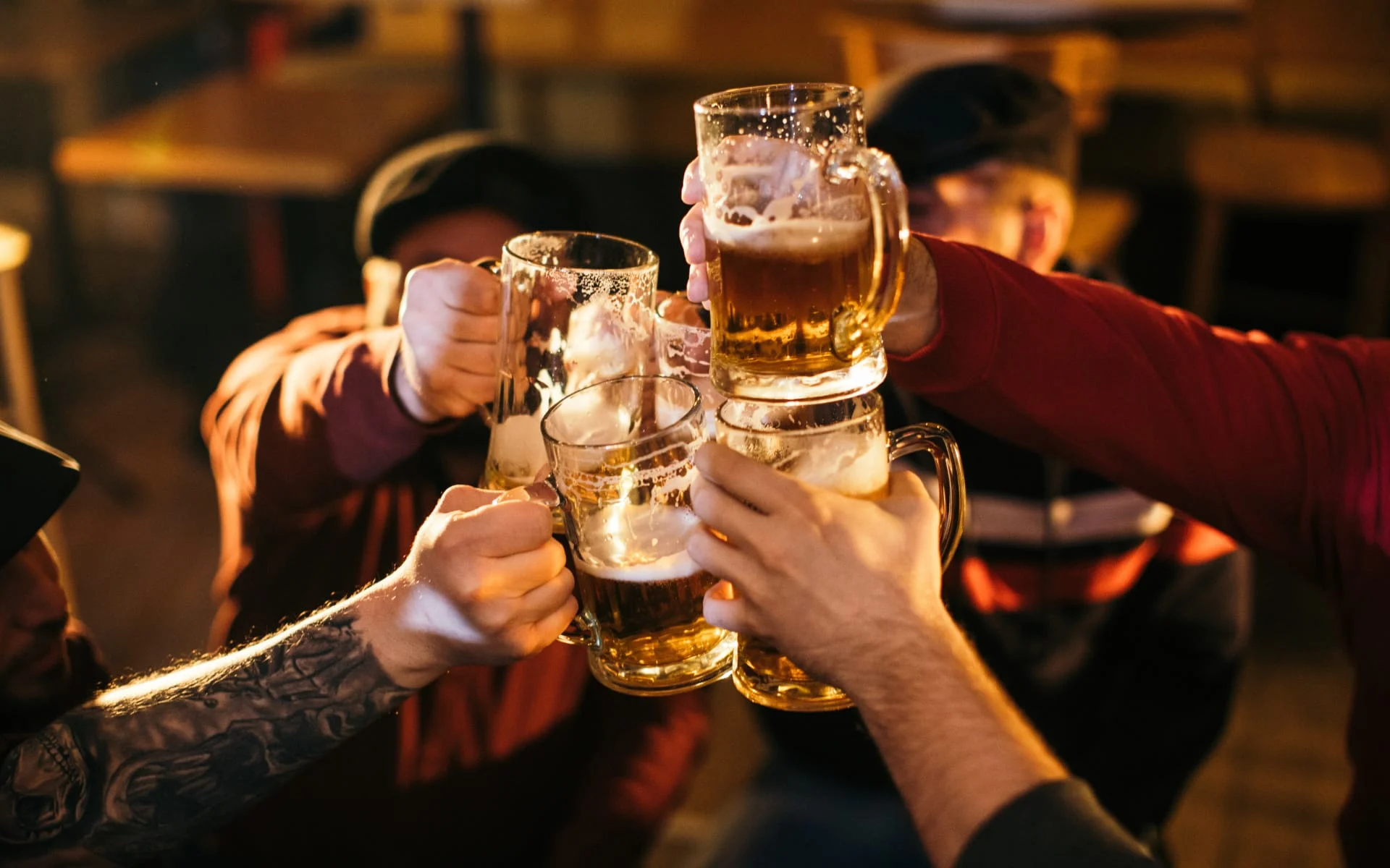 Corporate event at Botanic Beer Garden in Houston with colleagues networking in an open-air garden bar setting.