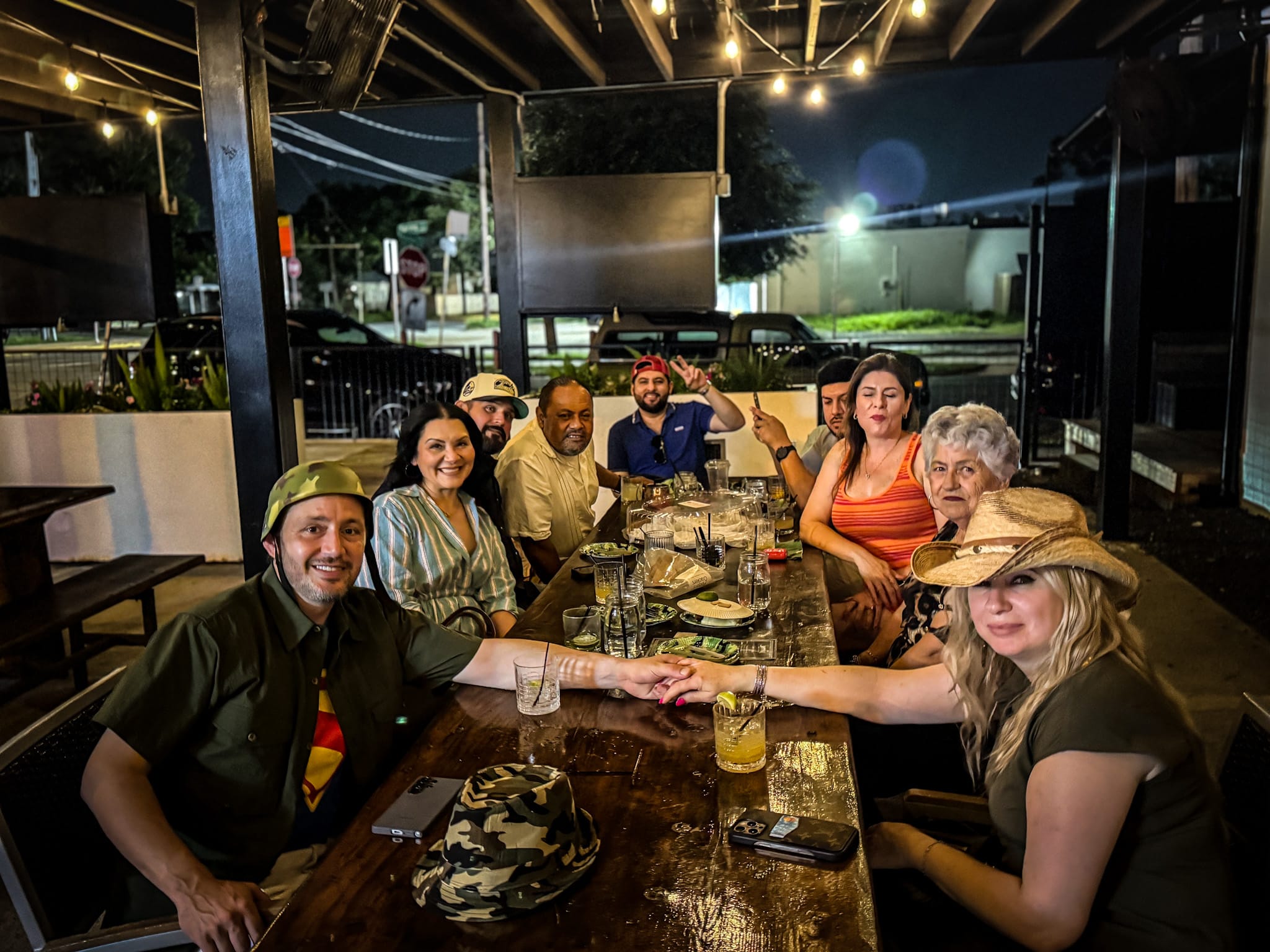 Birthday party celebration at Botanic Beer Garden in Houston with guests enjoying craft cocktails in an outdoor garden setting.