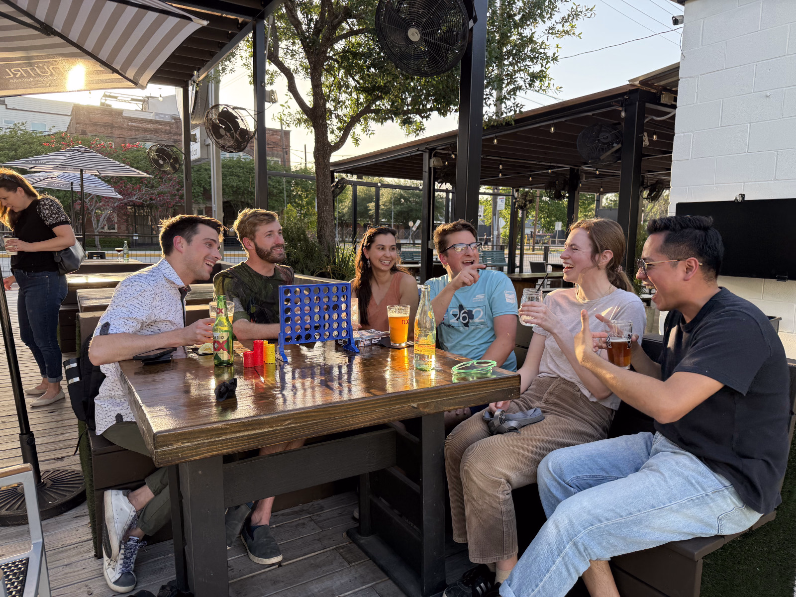 Group Hangout at Botanic Beer Garden Friends enjoying drinks and local beer on the patio at Botanic Beer Garden in The Heights