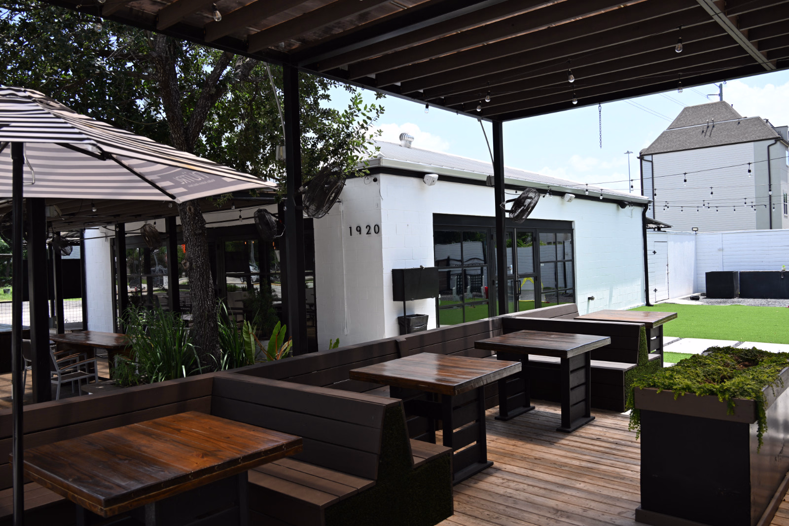 Outdoor Booth Seating at Botanic Beer Garden Outdoor booth seating at Botanic Beer Garden in The Heights with open-air patio dining