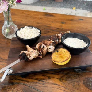 Chicken kabob in Houston with jasmine rice and tzatziki sauce at Botanic Beer Garden