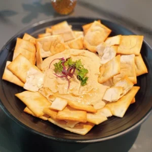 Hummus with pita chips in the Heights at Botanic Beer Garden